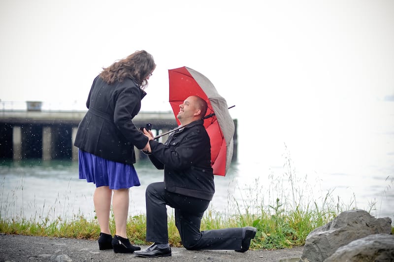 man down on one knee in the rain