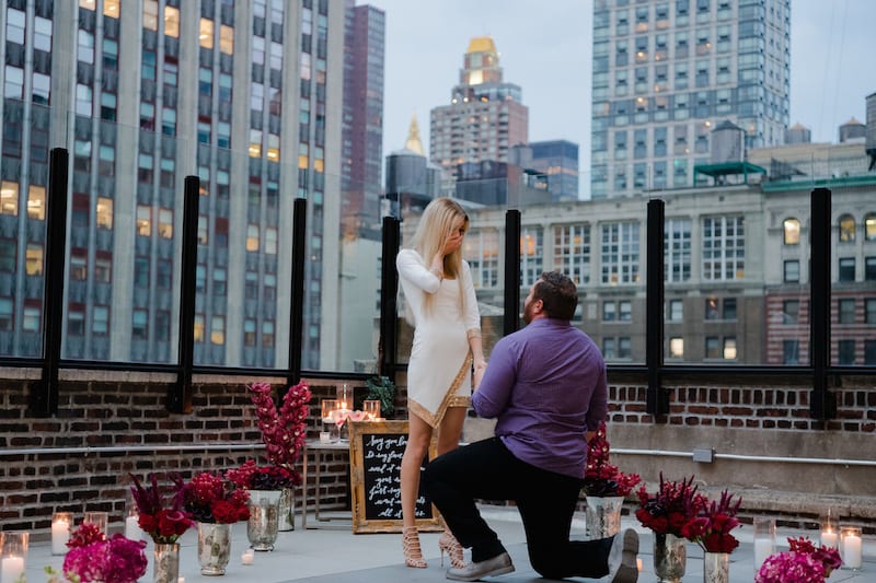 Rooftop Proposal in NYC with skyline view