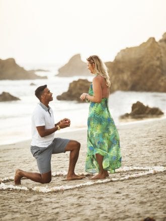beach proposal with heart in sand