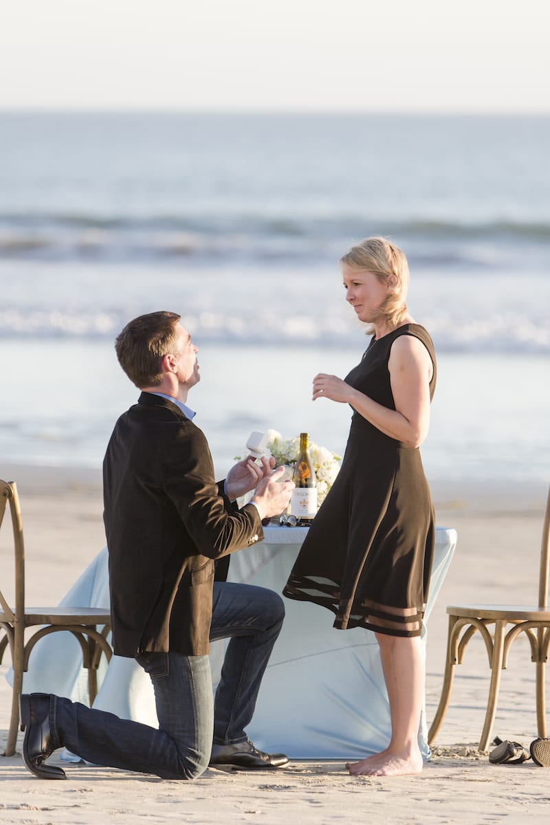 couple getting engaged on the beach in san diego