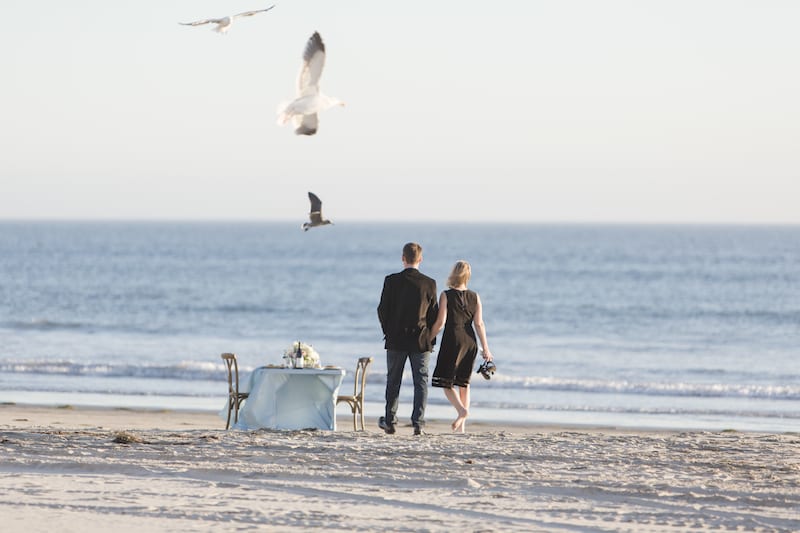 couple getting engaged on the beach in san diego