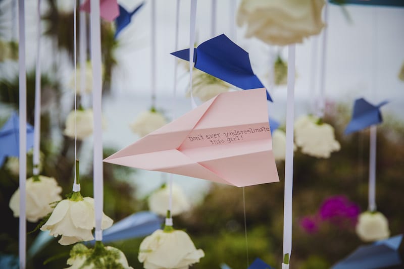 wedding proposal with pink paper plane