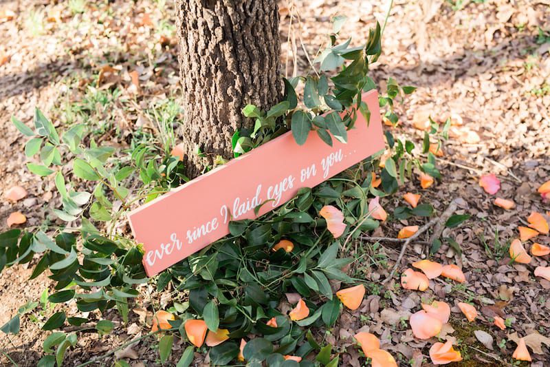 coral pink painted wood sign