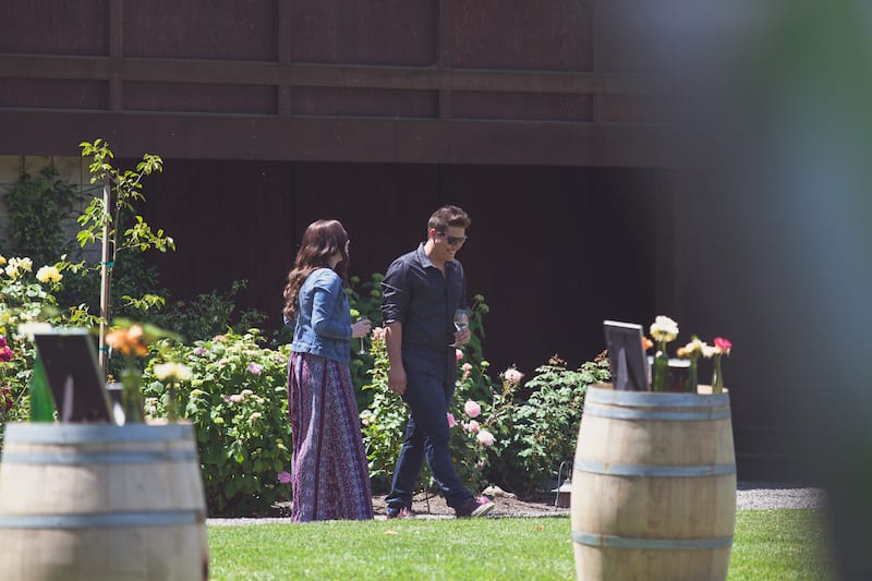 flowers and frames on wine barrels