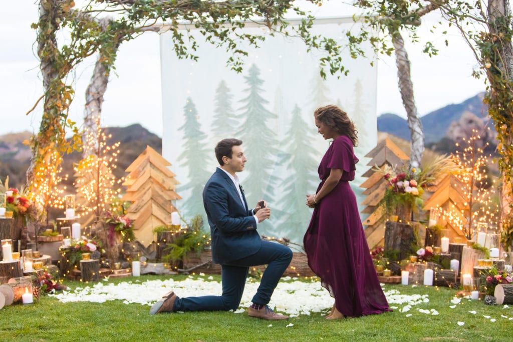 man proposing with beautiful set up