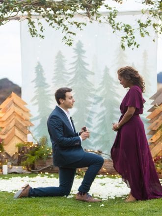 man proposing with beautiful set up
