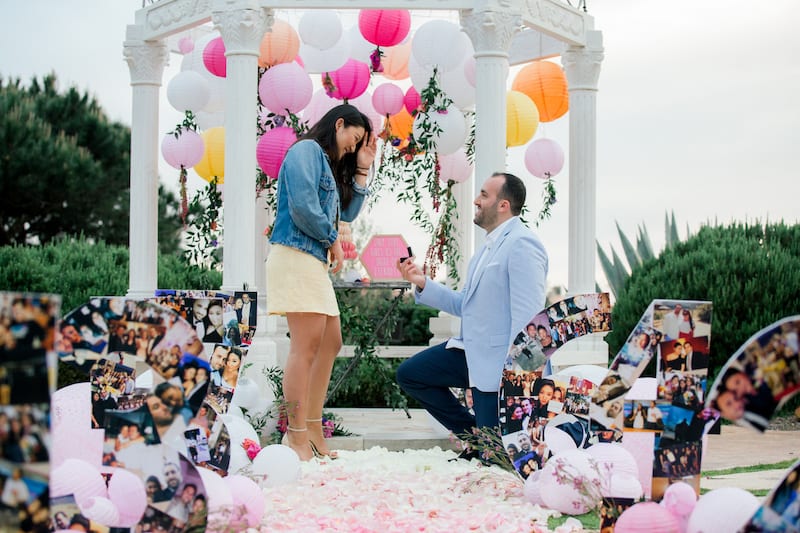 Lots of photos and flowers at Southern California garden gazebo wedding proposal 