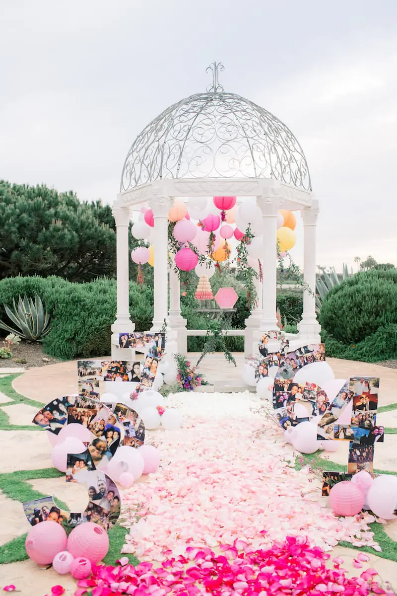 pink rose petals aisle gazebo for marriage proposal at monarch beach