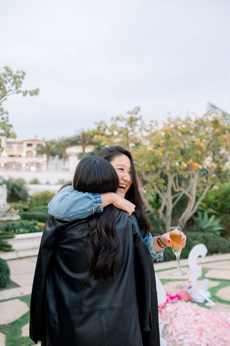 friends hugging at dana point ca engagement party