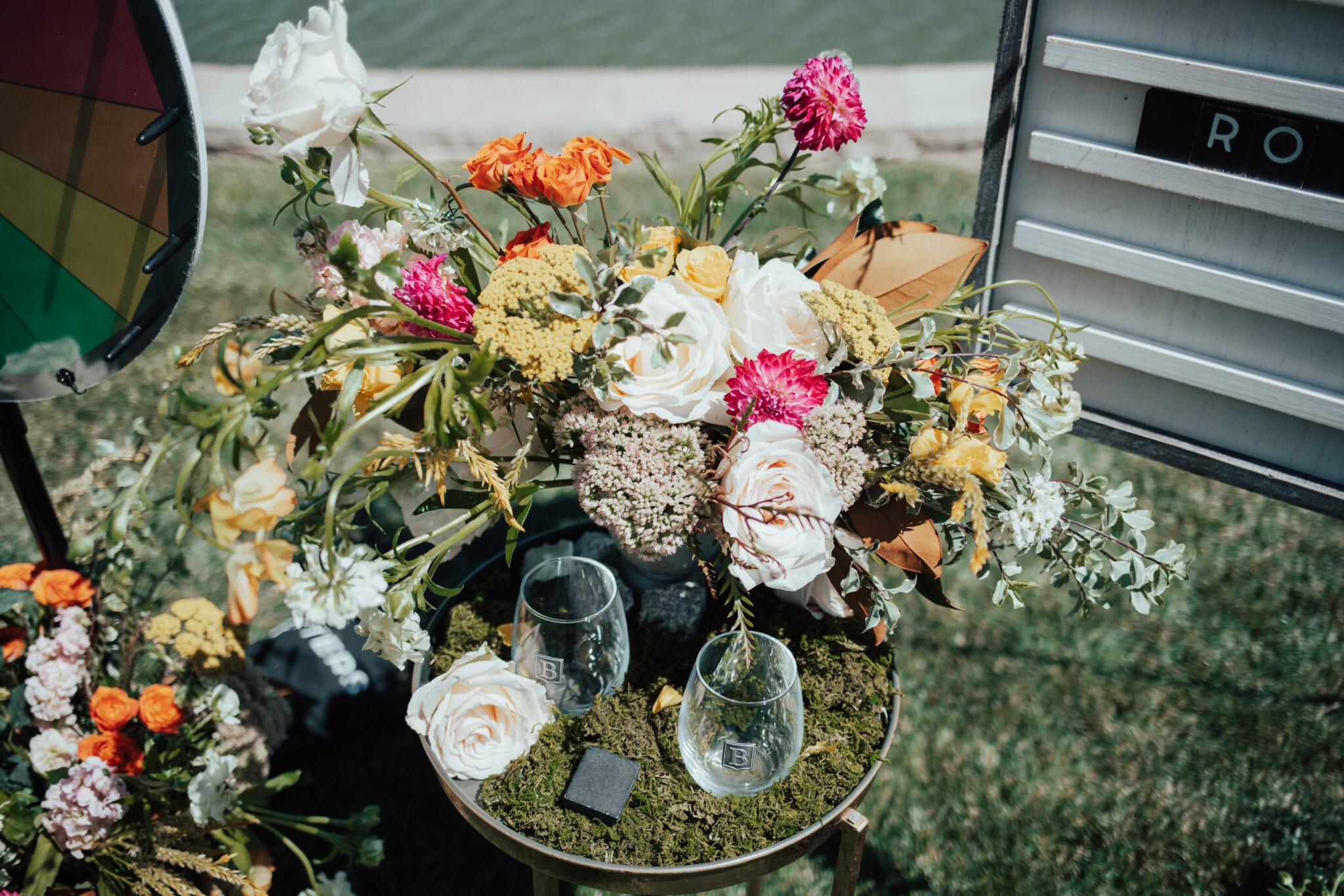 colorful arrangement with scrabble piece wine glasses