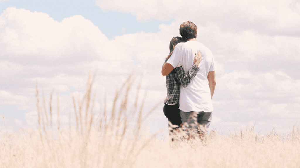 Couple Hugging in field