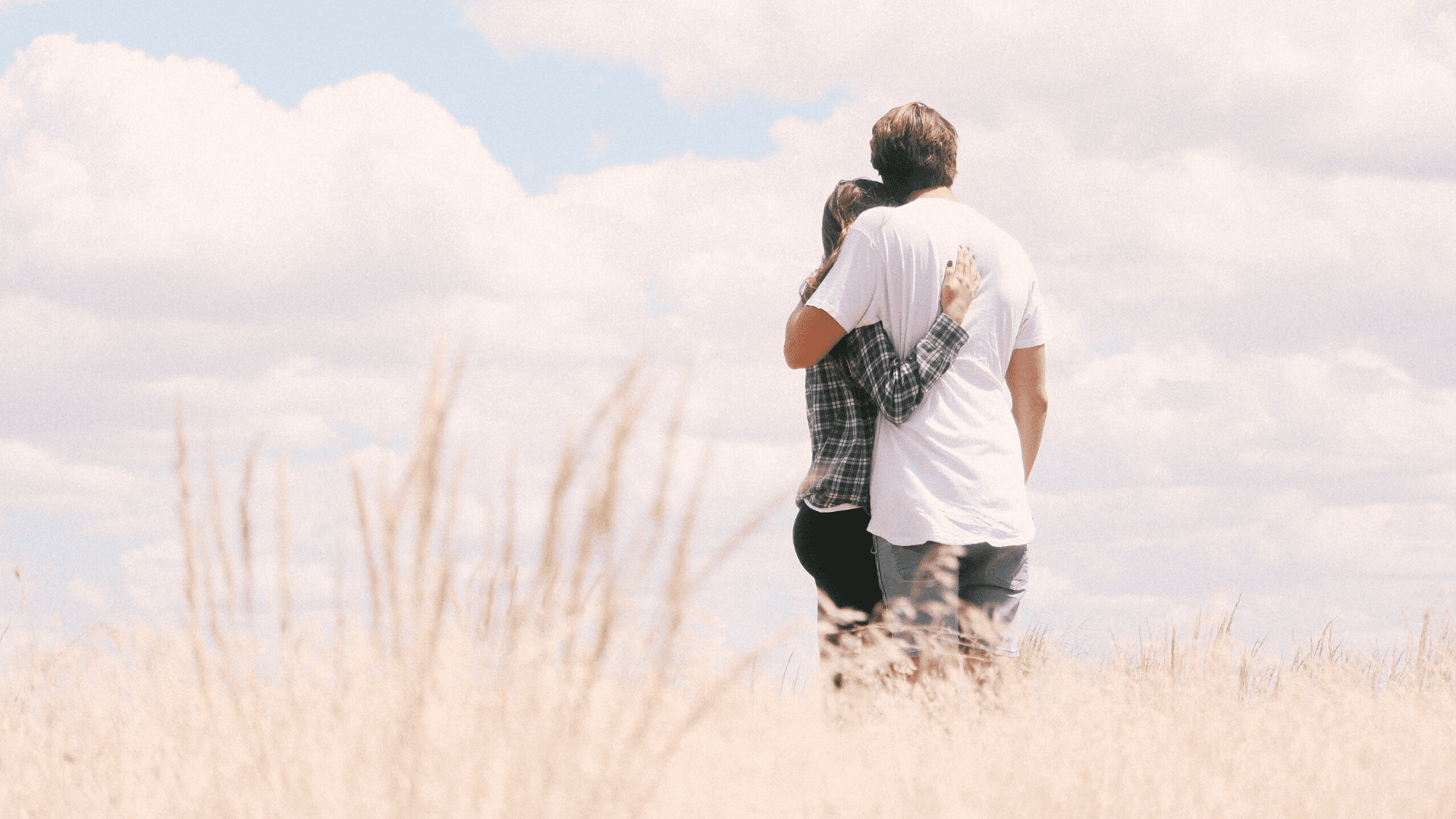 Couple Hugging in field
