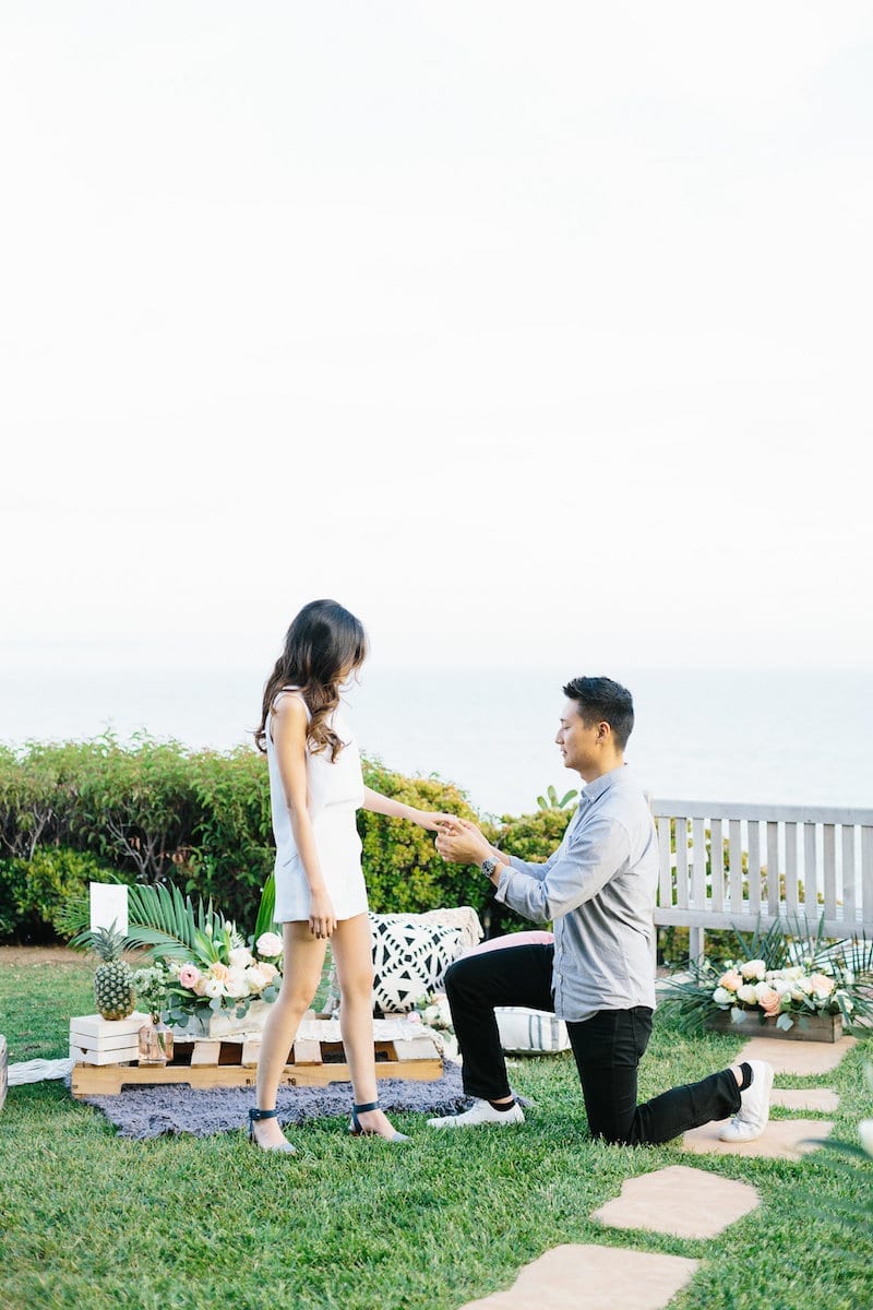 man proposing in malibu
