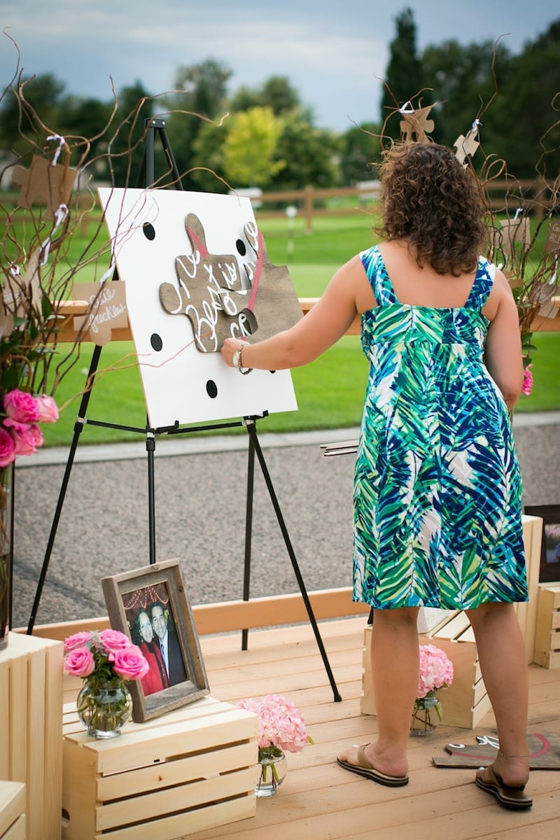 woman putting together puzzle