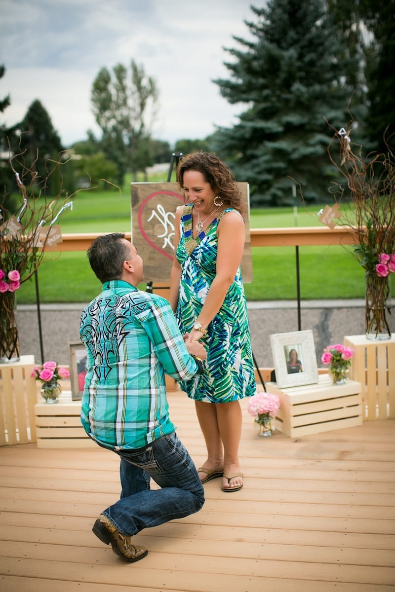man proposing on deck
