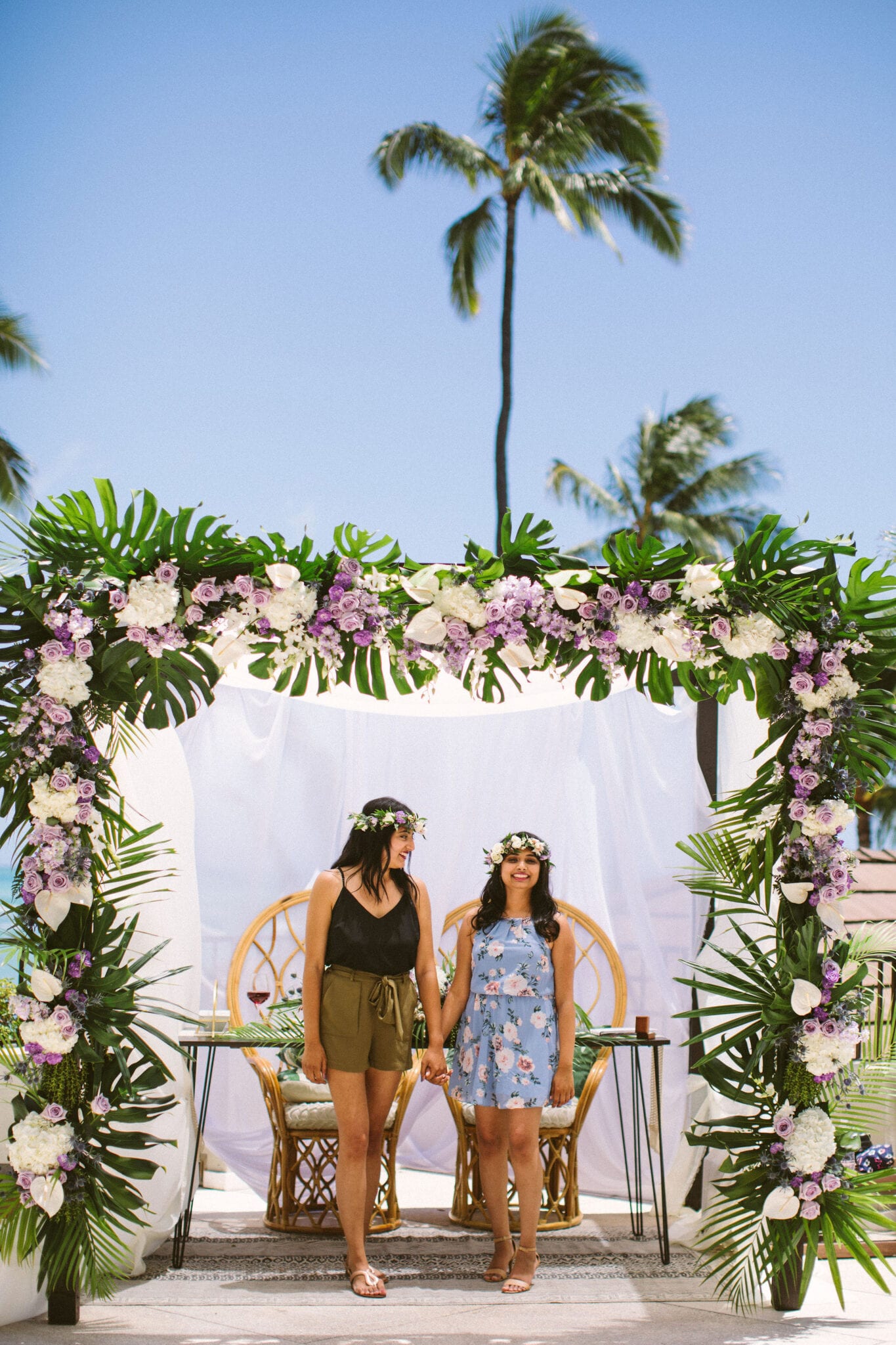 couple holding hands in hawaii