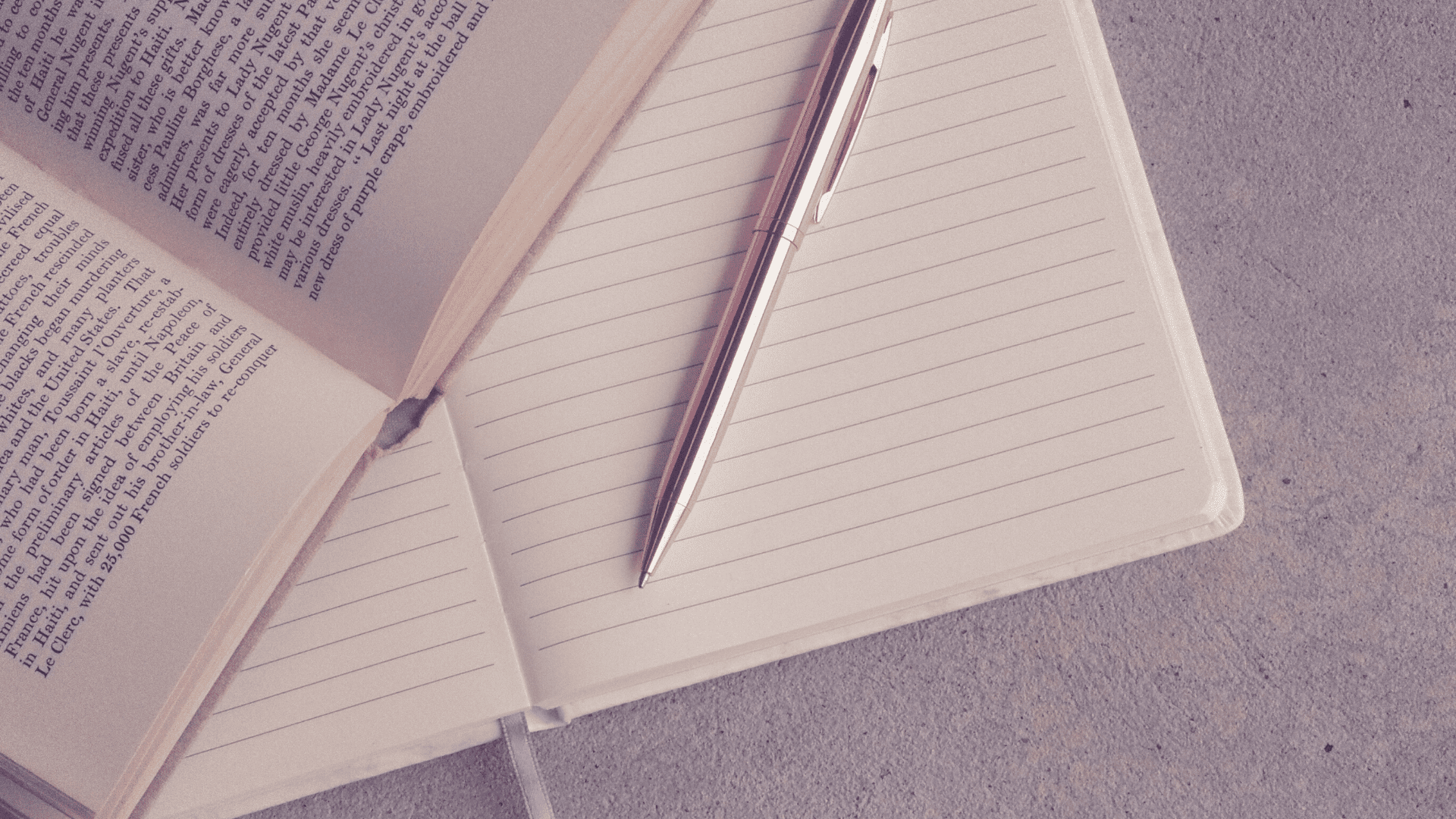 Book, paper and gold pen