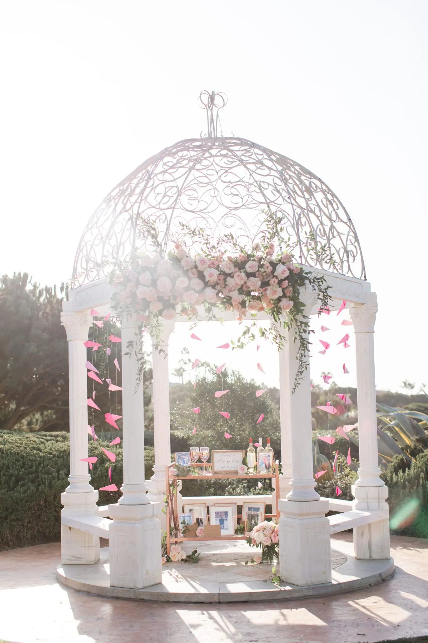 gazebo decorated in pink flowers | waldorf astoria marriage proposal by the yes girls