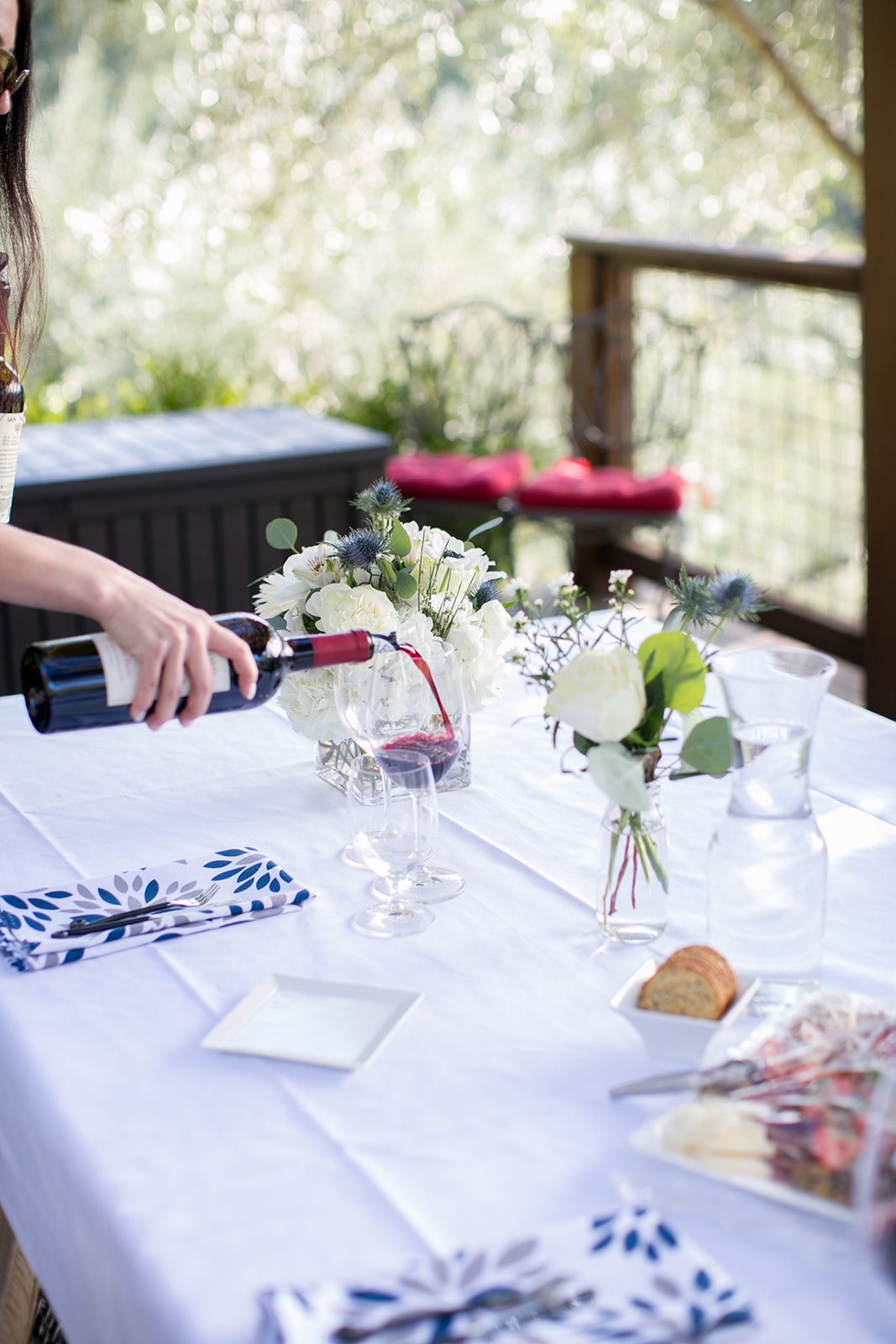 pouring wine at pretty table