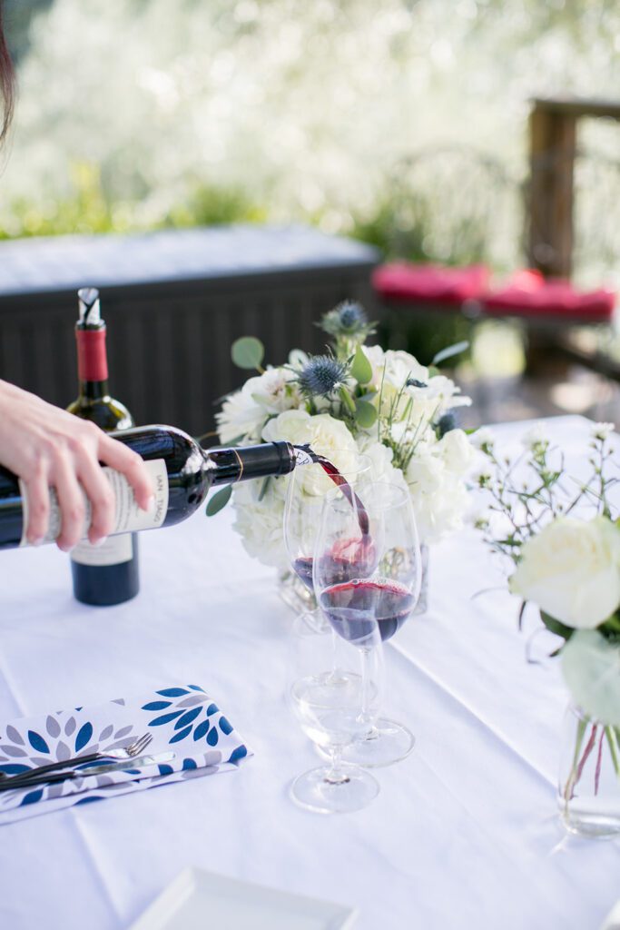 pouring wine for a winery marriage proposal