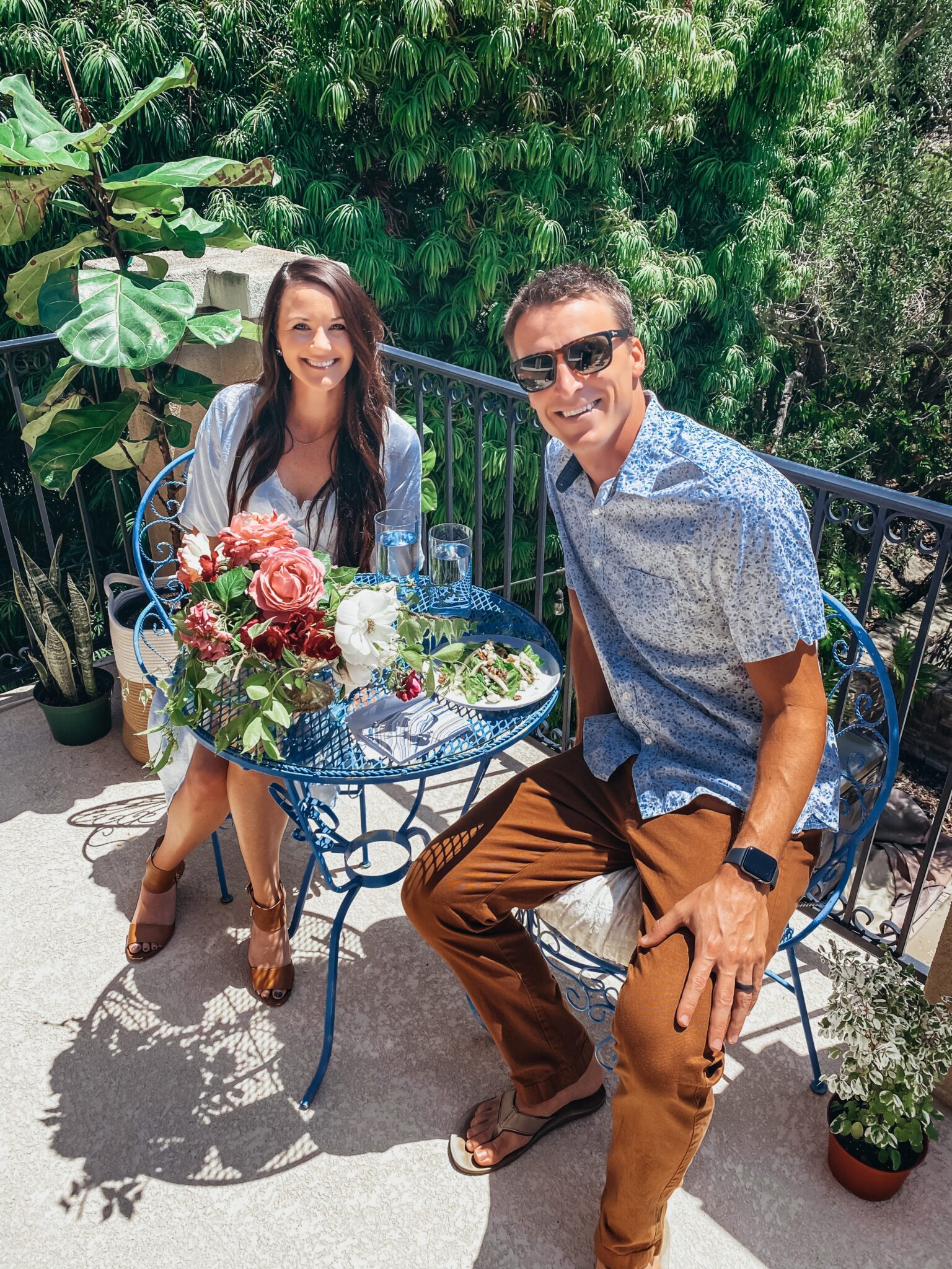 couple sitting at table on balcony