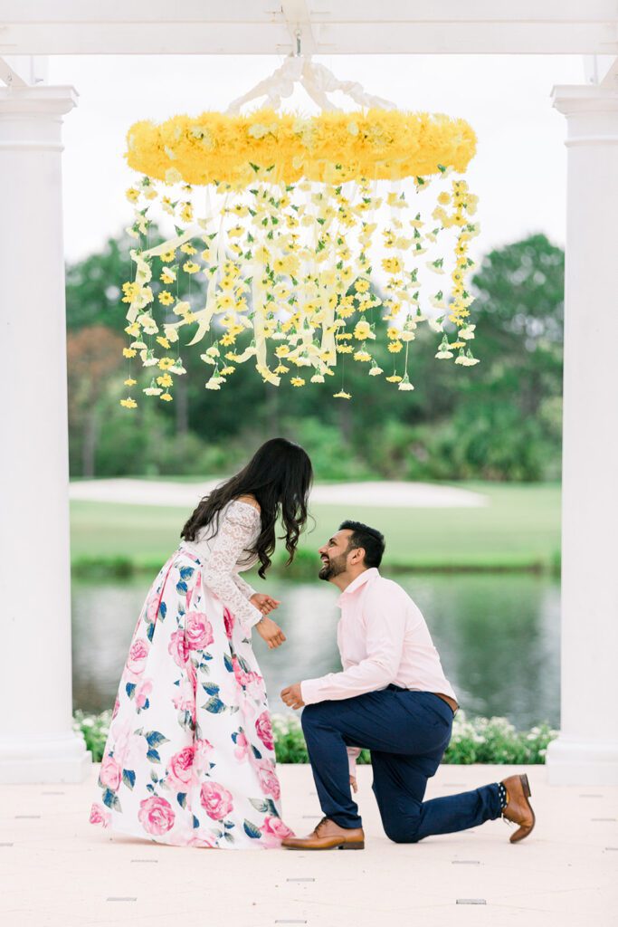 man down on one knee floral chandelier