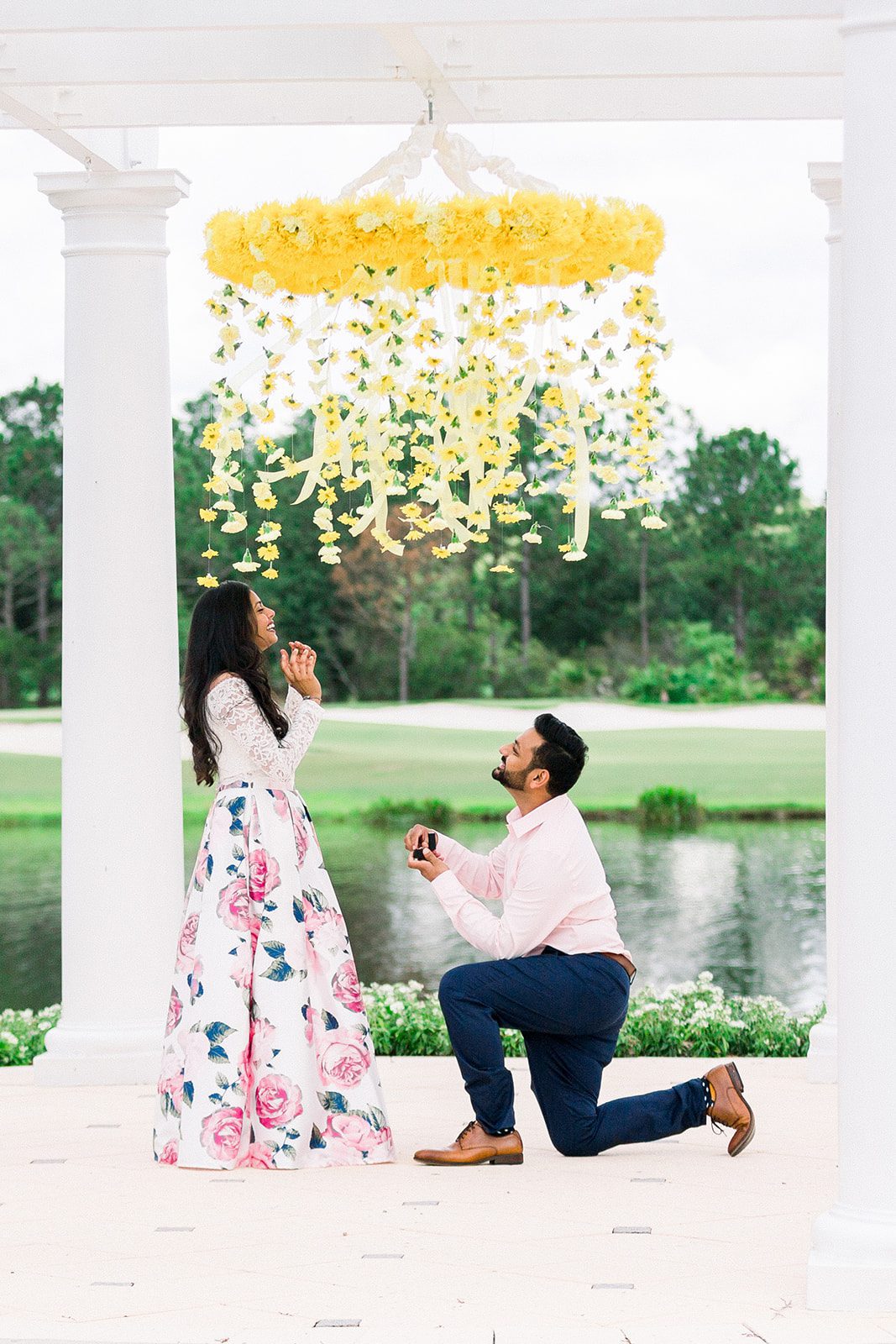 Man down on one knee floral chandelier