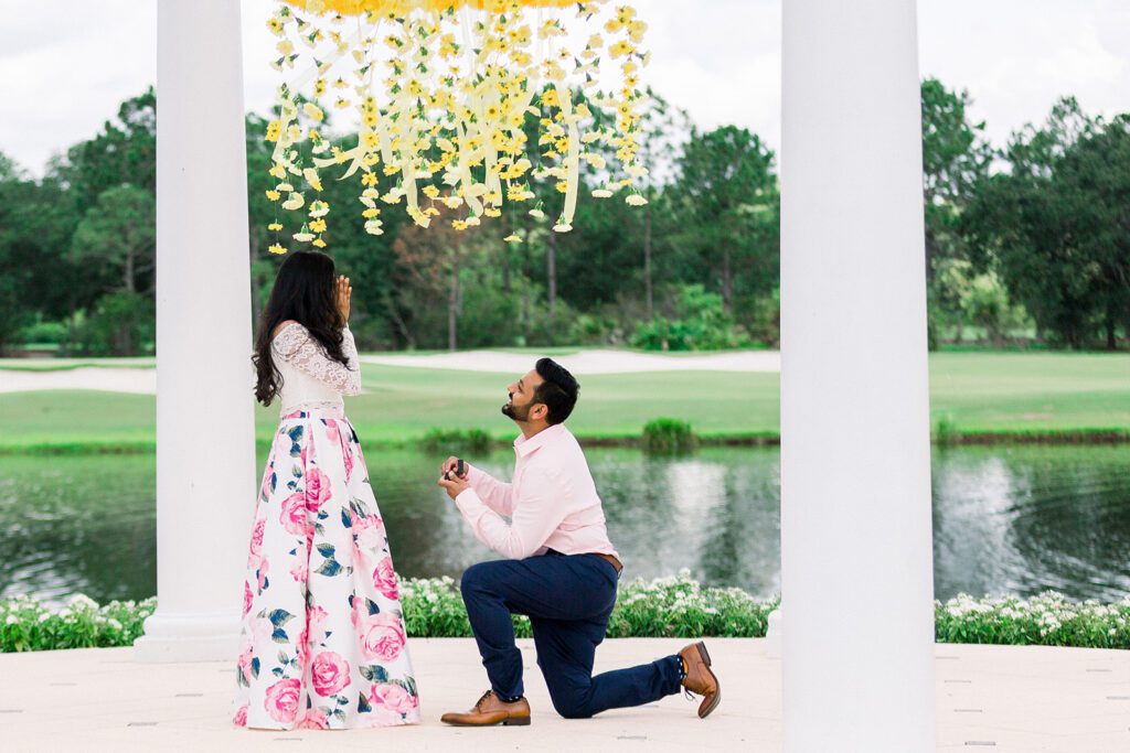 Man down on one knee floral chandelier