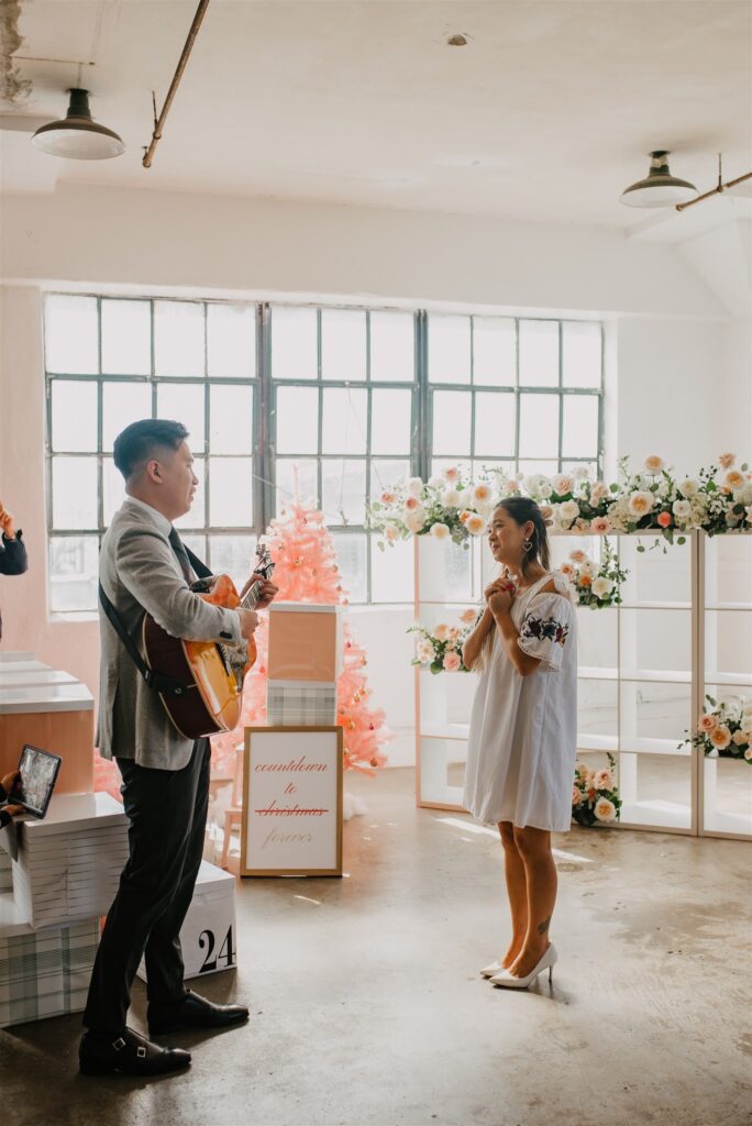 Client playing the guitar for his proposal 