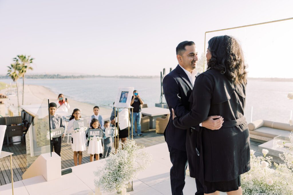 family celebrating marriage proposal 