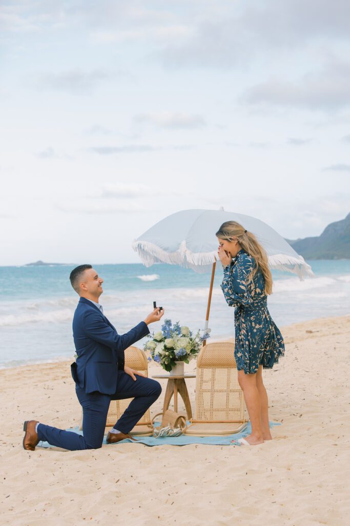 Man proposing to girlfriend on the beach in Hawaii