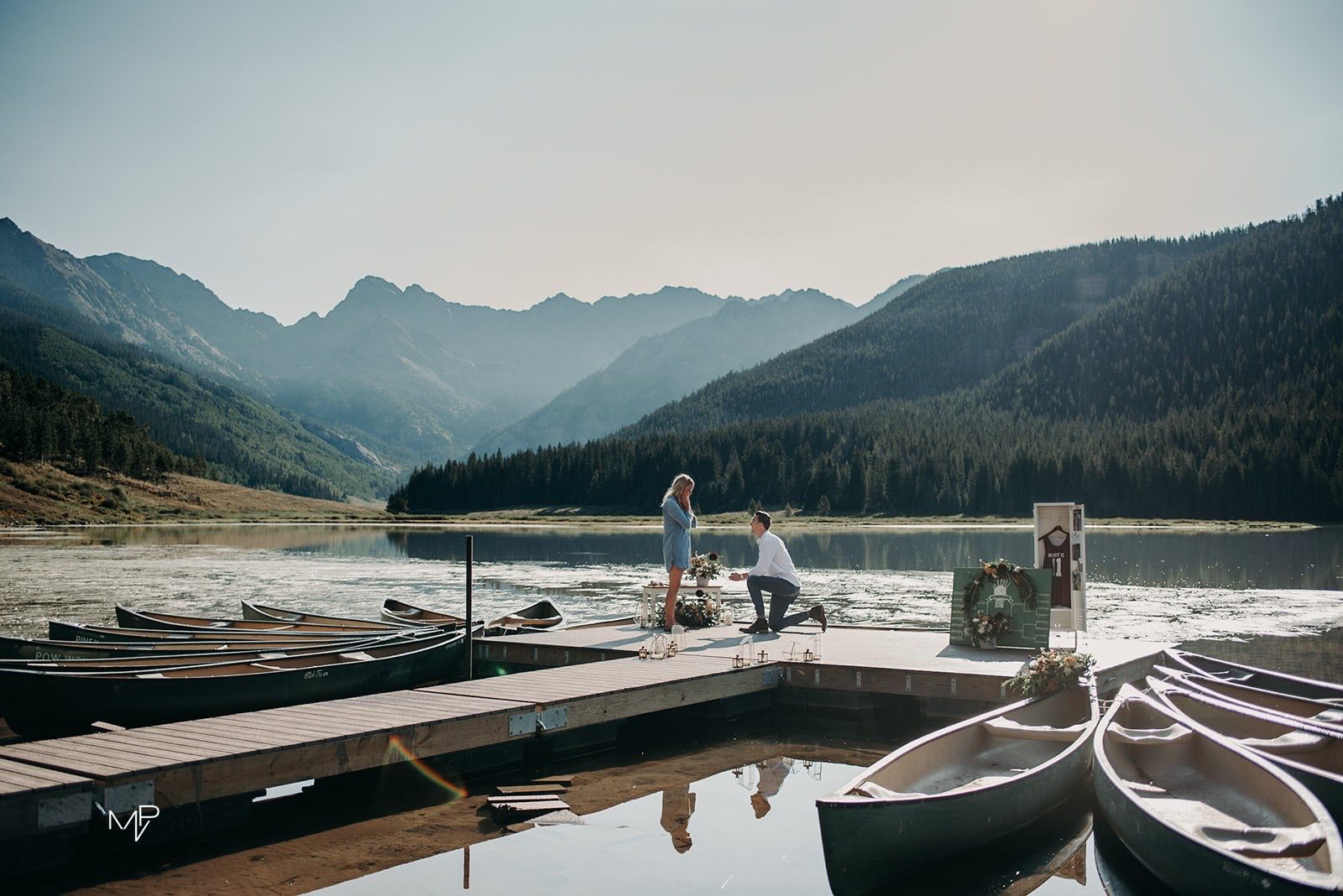 Couple getting engaged on lake 