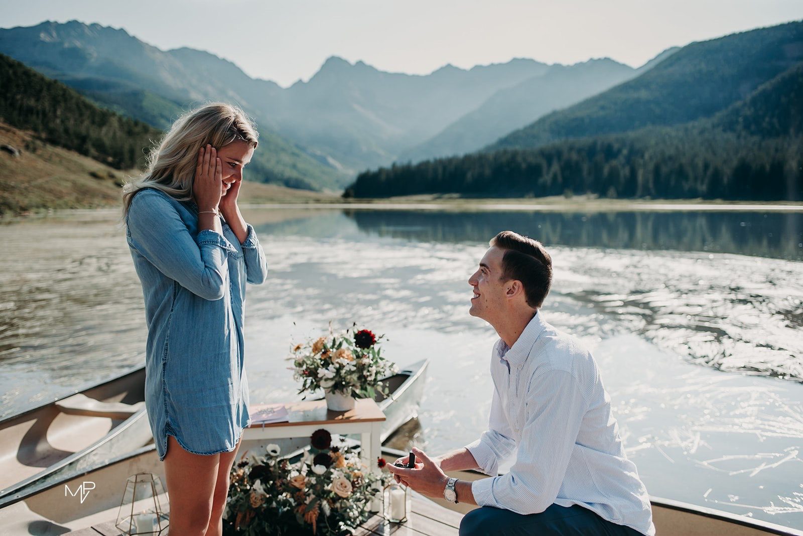 Couple getting engaged on lake