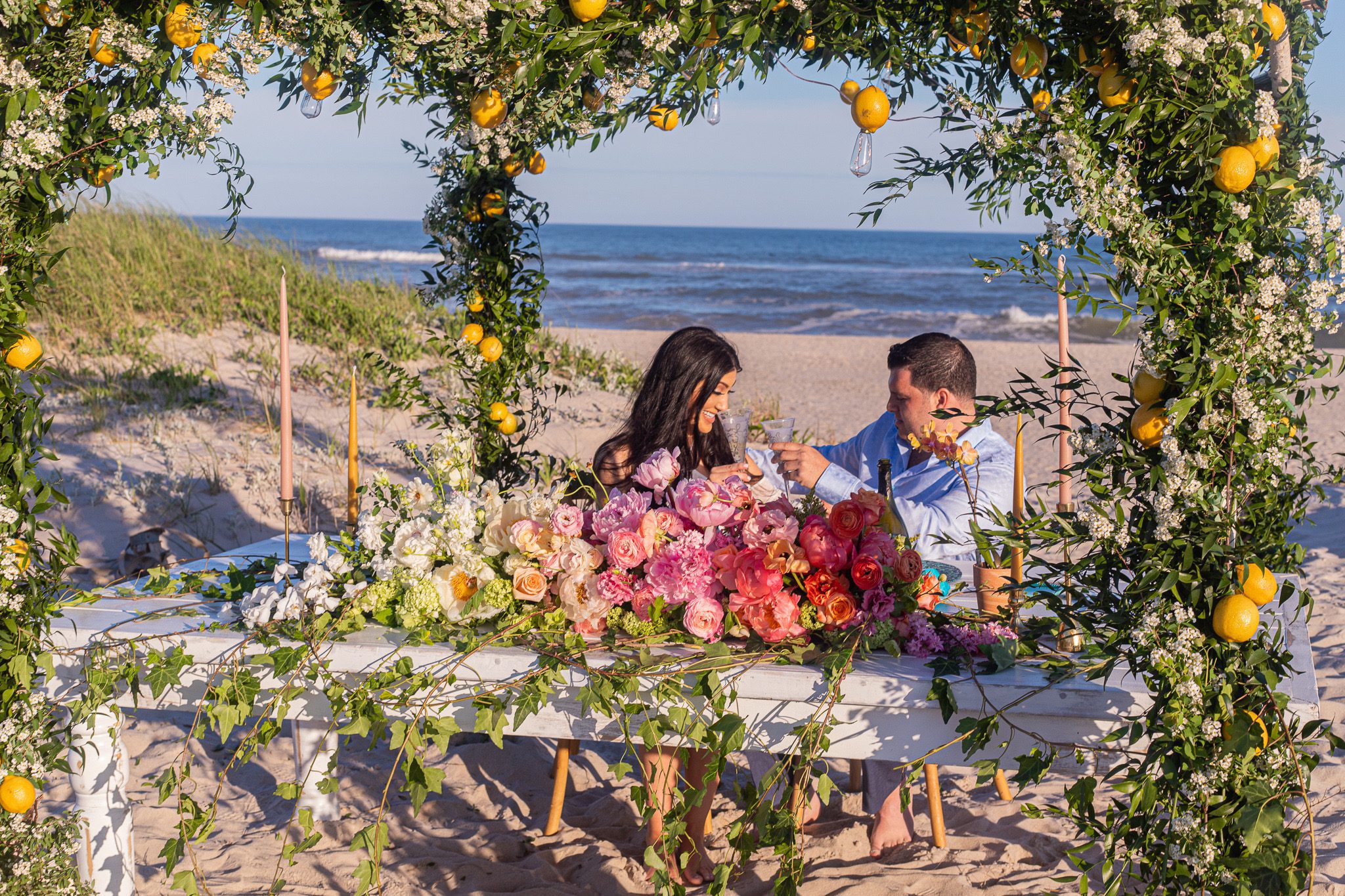 Couple celebrating proposal on gorgeous beach