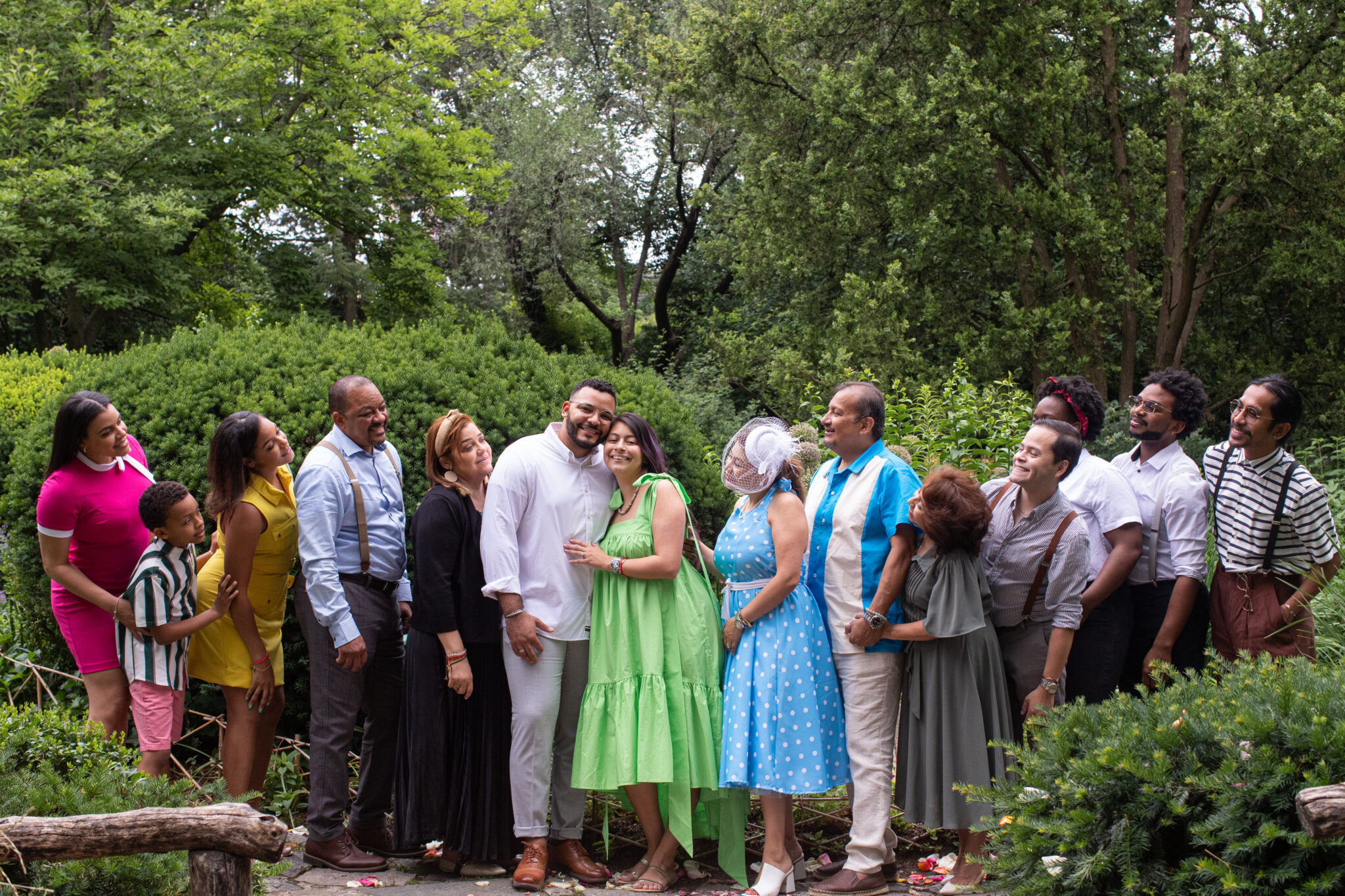 Family celebrating marriage proposal in central park