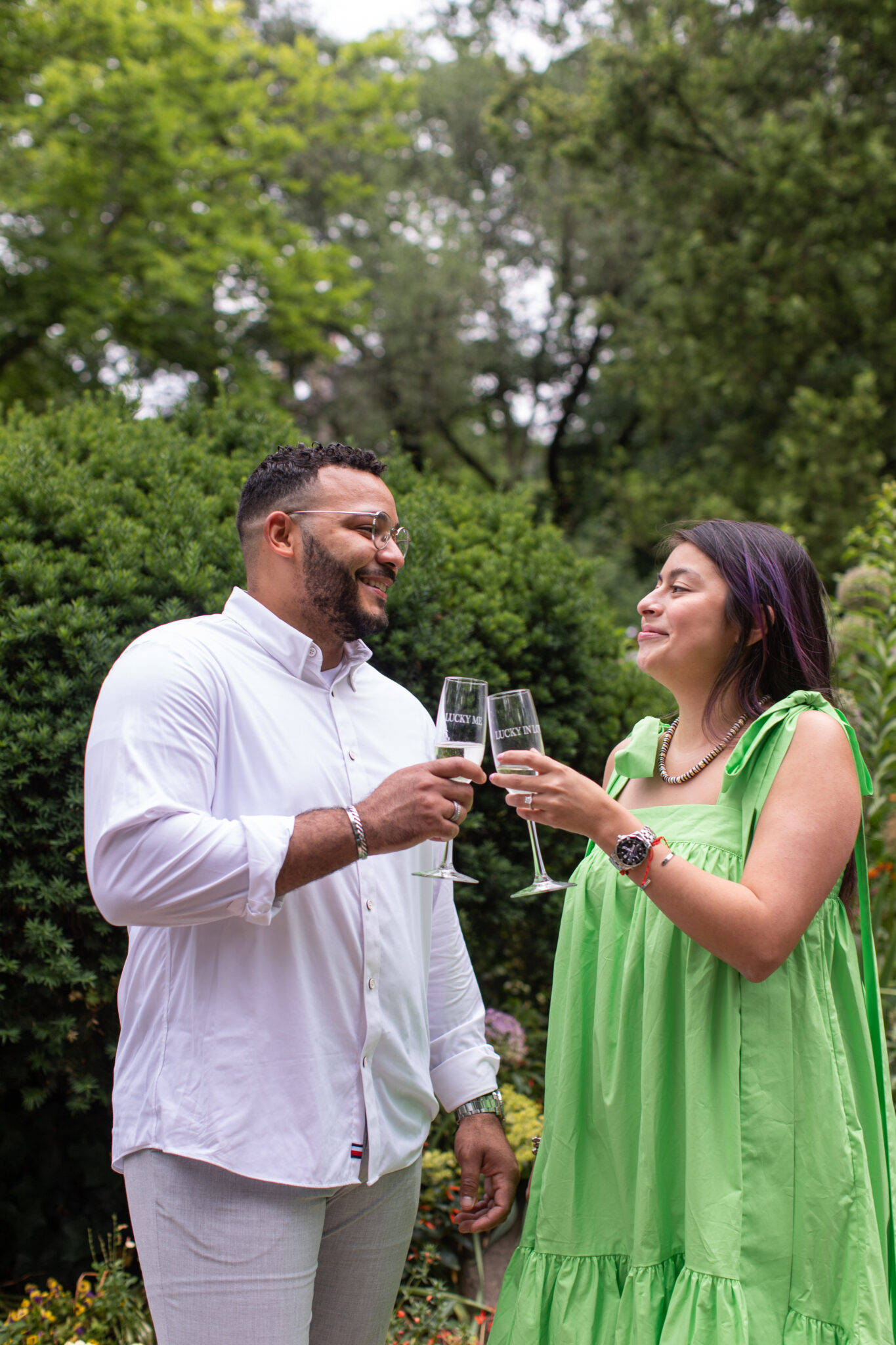 Newly engaged couple toasting champagne