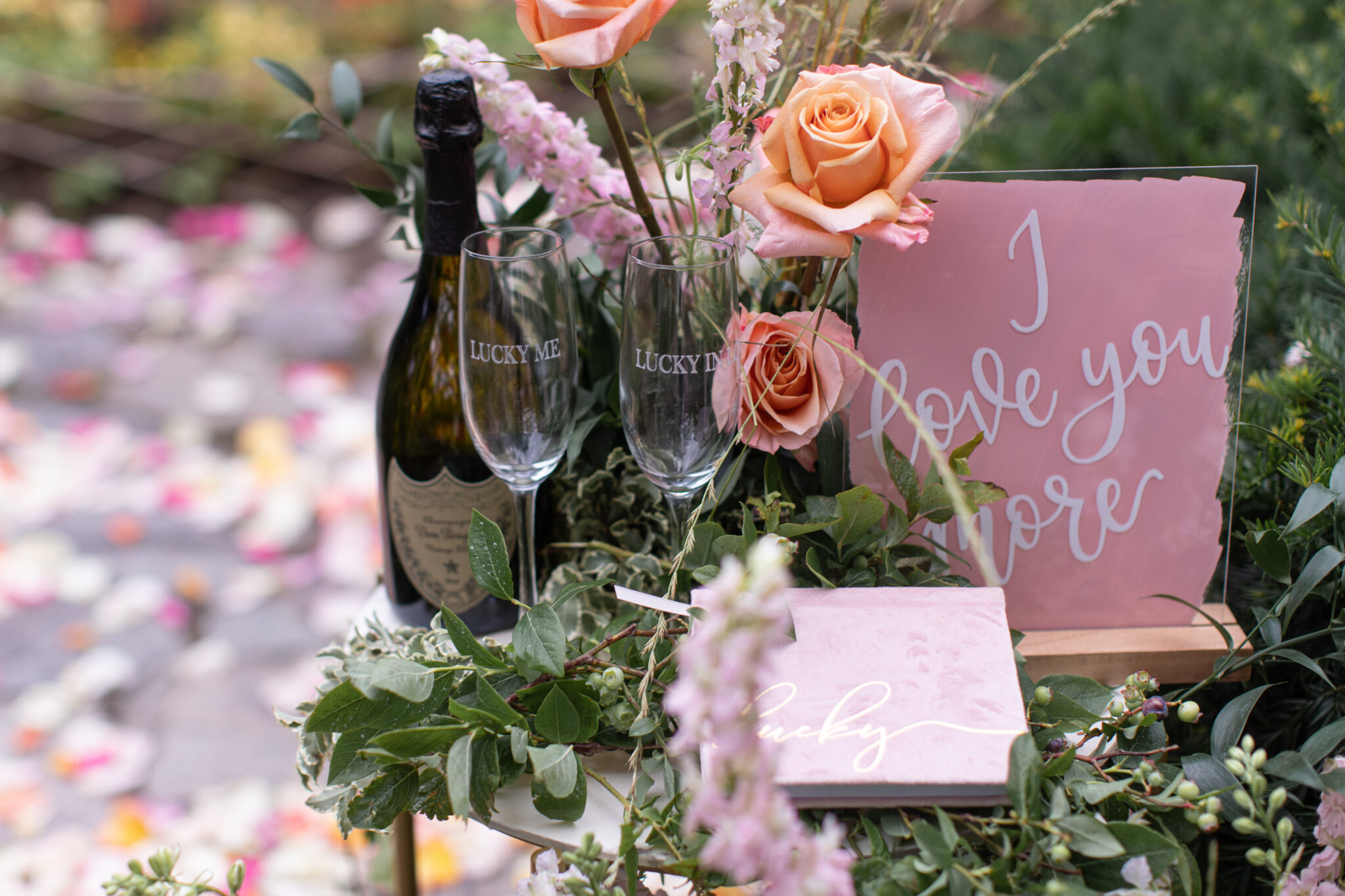 close up of wine and flowers for proposal