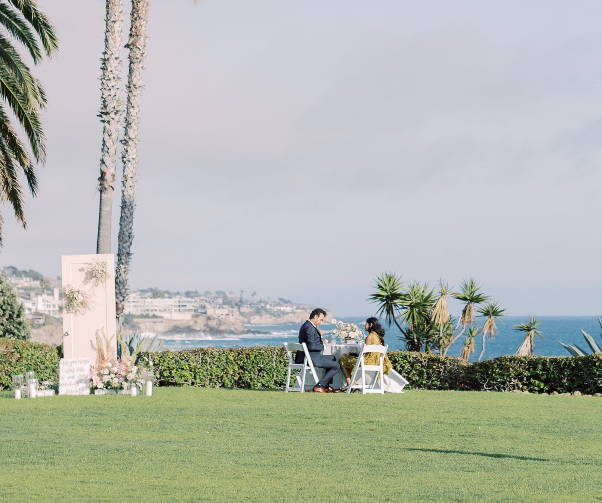 couple enjoying dinner after proposal in laguna beach