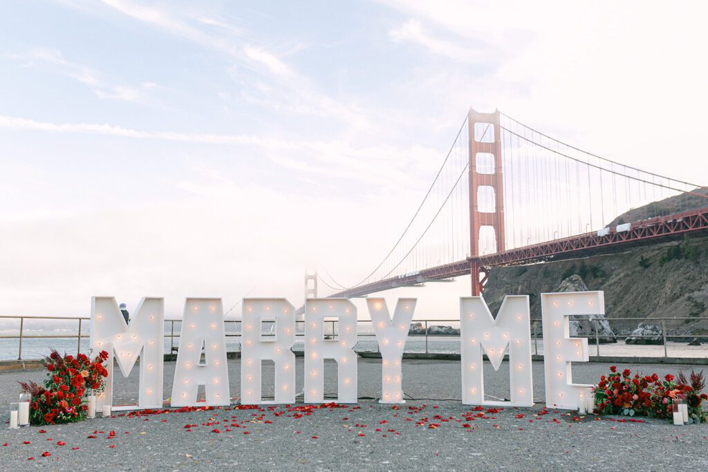 Marry Me sign in front of golden gate bridge