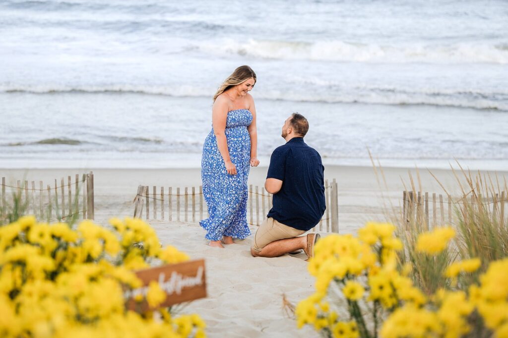 man proposing on beach