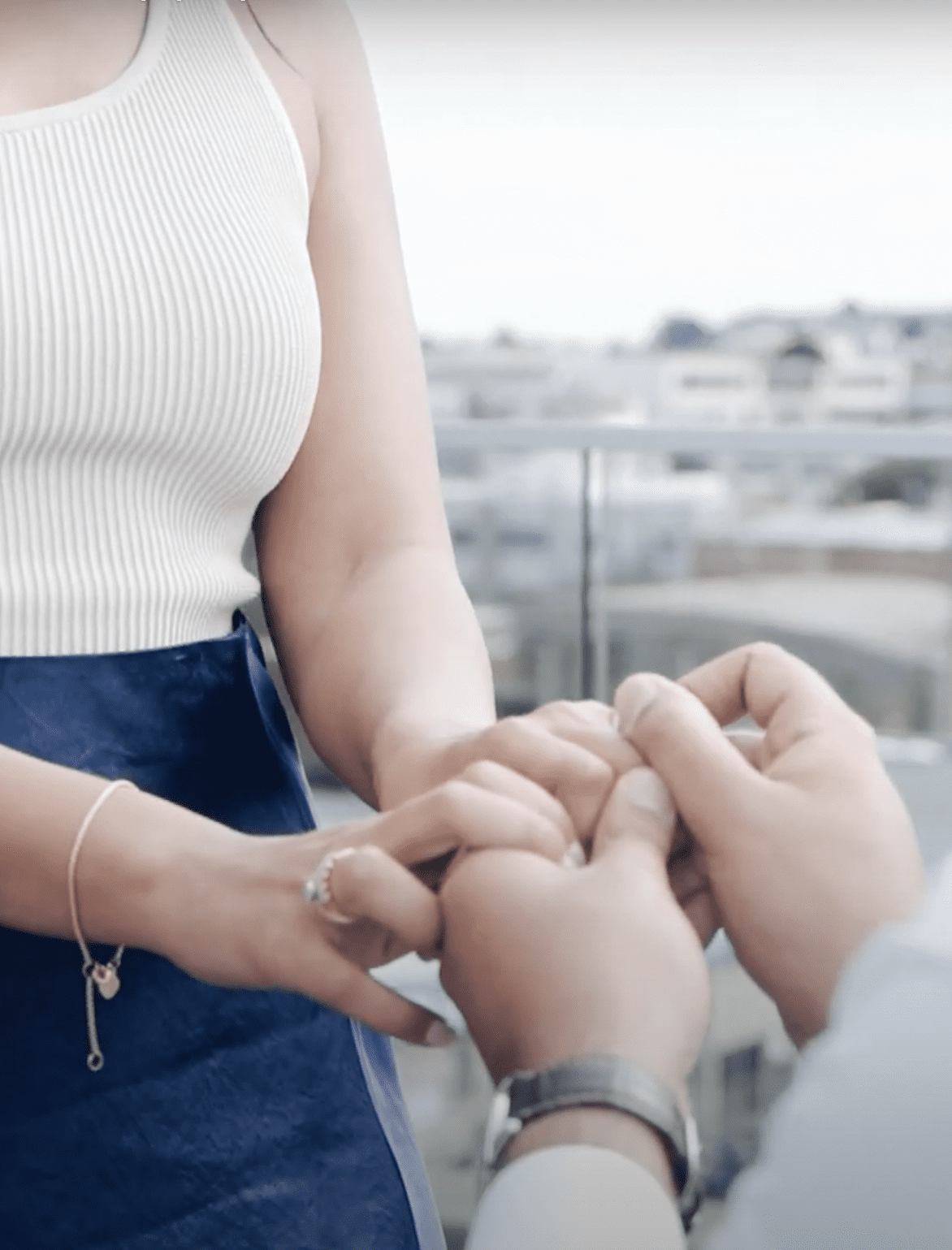 man proposing with ring in San Francisco rooftop