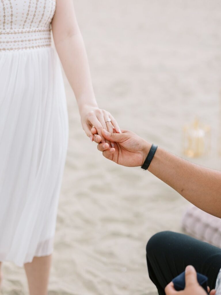 man proposing on beach