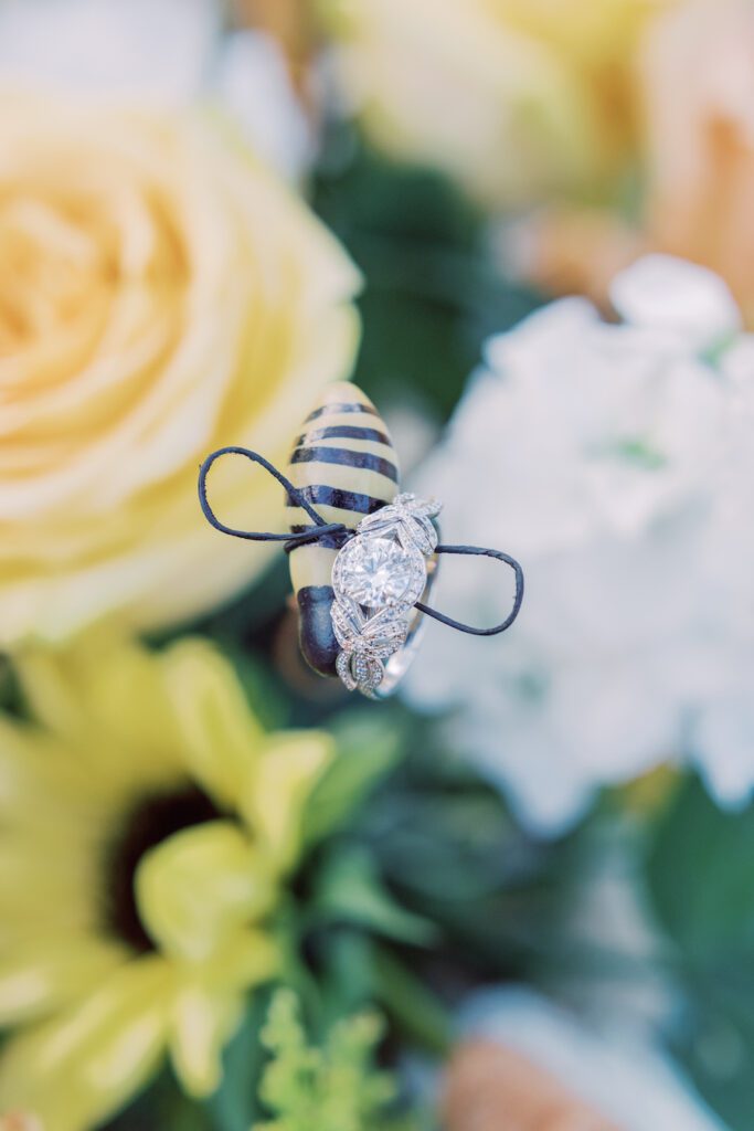 engagement ring on faux honey bee