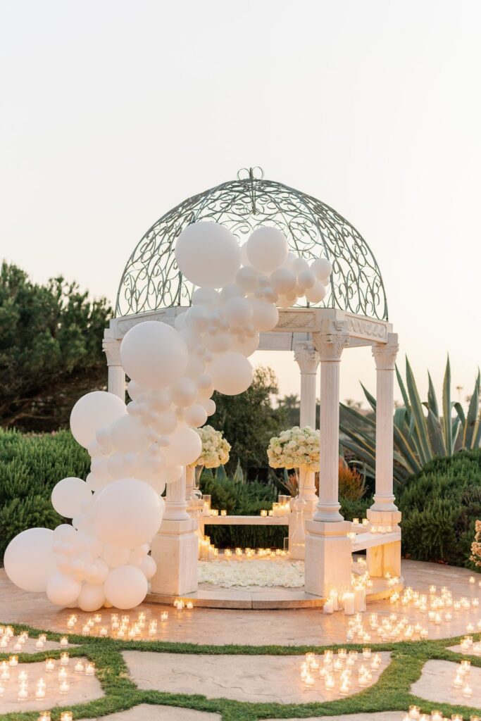 luxury marriage proposal with balloons, flowers and candles at monarch beach gazebo by the yes girls