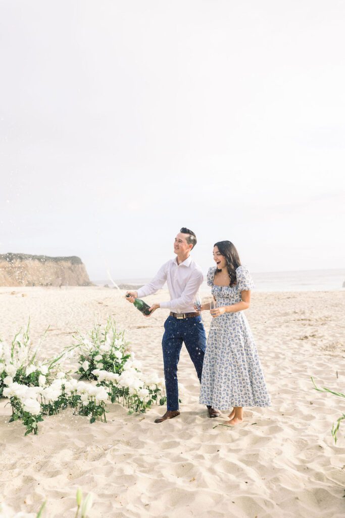 celebrating after private luxury beach proposal half moon bay