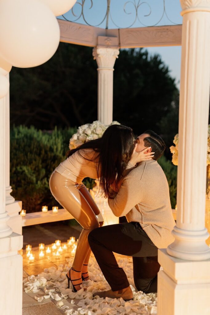 couple kissing after proposal in orange county