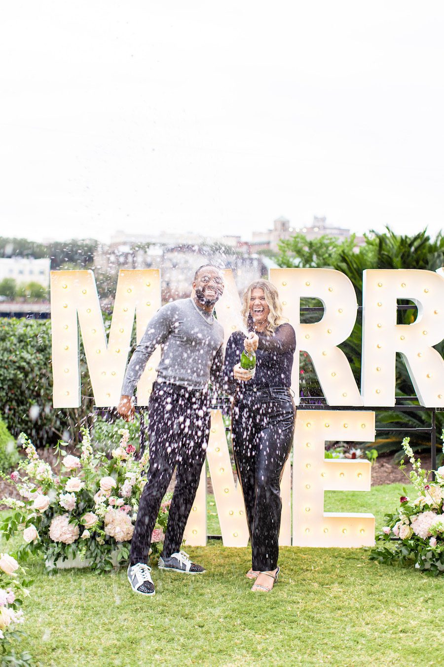 marry me letters and champagne bottle spray