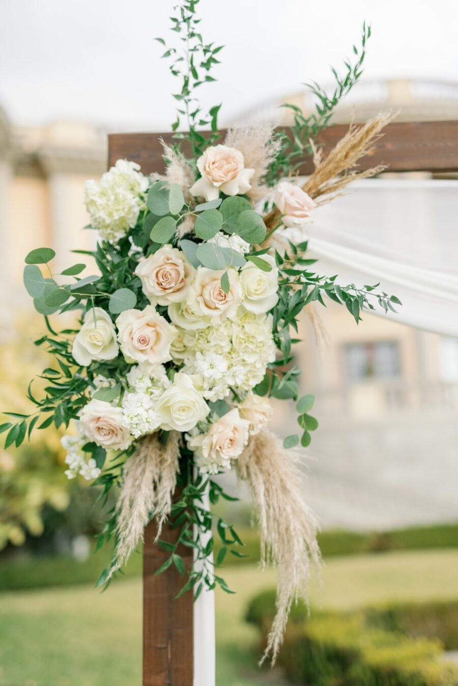 white and blush flowers arch with flowers proposal flowers