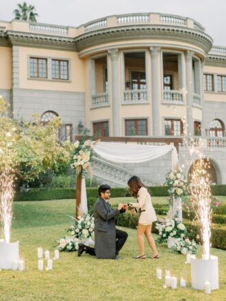 marriage proposal down on one knee surprise proposal spark fountains arch with flowers mansion proposal LA proposal Pasadena princess