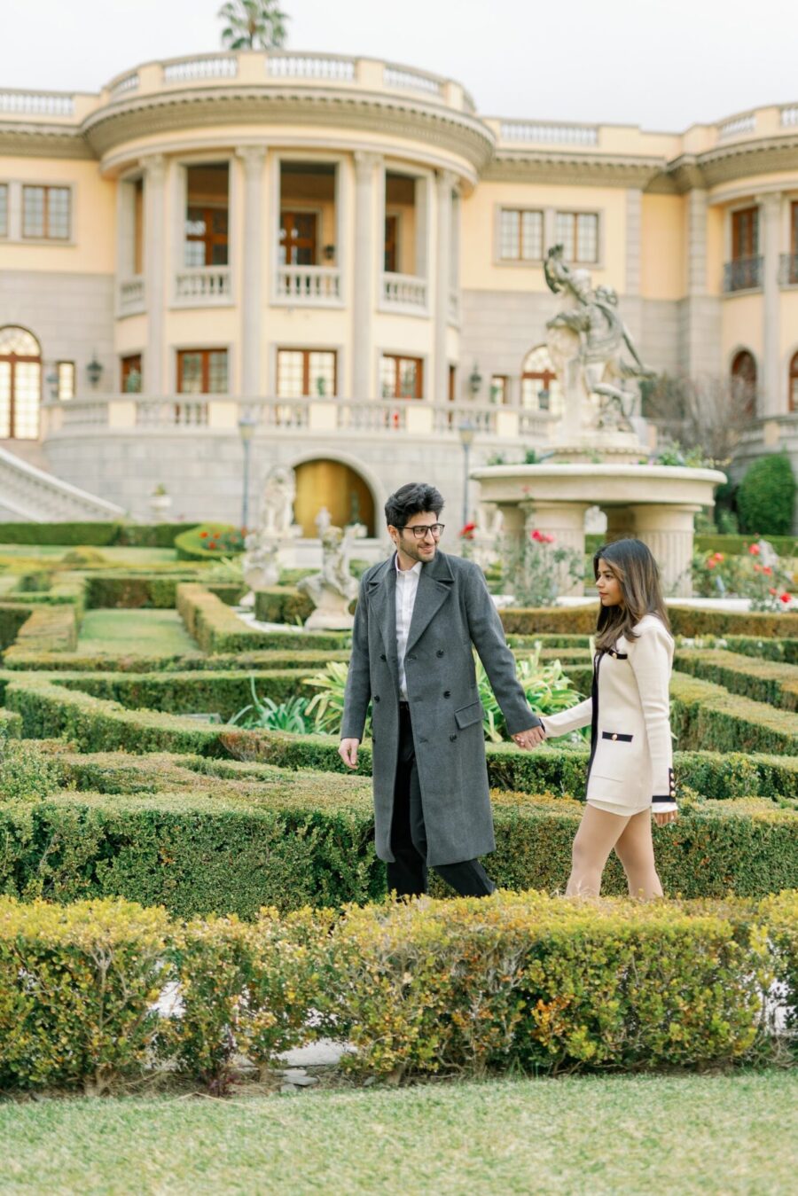 couple holding hands surprise proposal mansion proposal LA proposal Pasadena princess